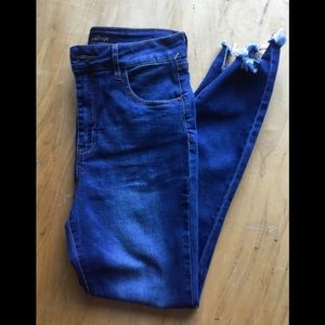 Refuge size 8 cropped jeans with distressed cuffs.